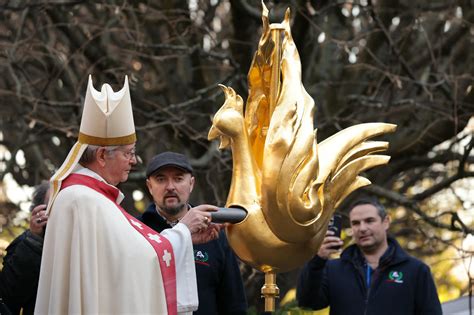 The cockerel being blessed, and relics returned