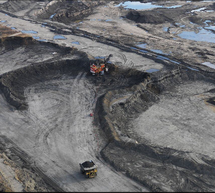 dump truck hauling away spoil and oil/tar sands. Image: Edward Burtynsky 