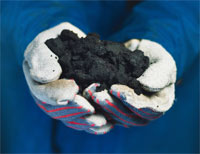 A handful of tar sands. Image credit: ostseis.anl.gov