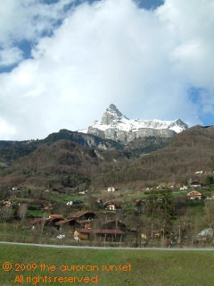 traditional dwellings, with the Aiguille de Varan in the distance