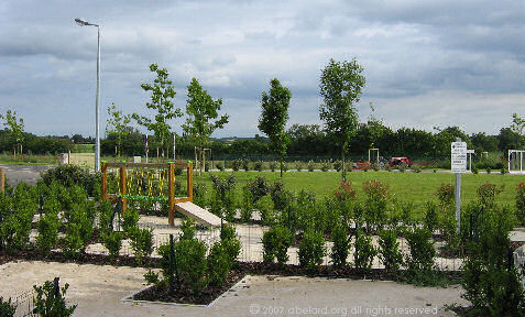 A young but classic French garden, with children�s play areas beyond.