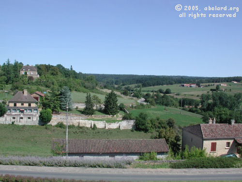 View  from Monpazier over rolling countryside.