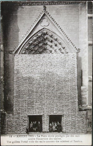 southern transept door, the door of the golden Virgin, protected by sandbags, 1915
