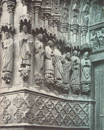 statues of saints, with Bishop Geoffroy on the right.