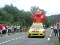 'devil' float in advertising caravan and crowd