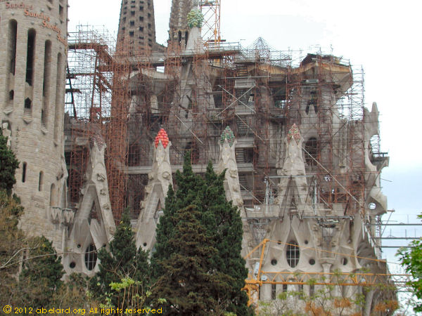 The exterior of the Sagrada Familia with scaffolding.