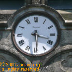 An analogue clock with Roman numerals